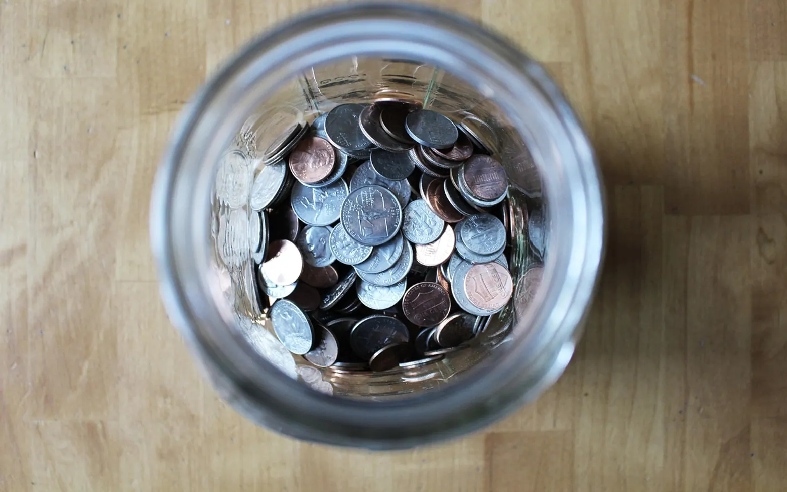 Jar, coins and currency