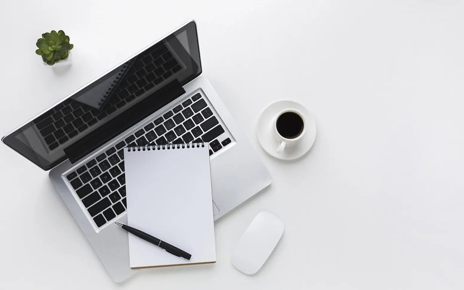 Laptop, coffee and notebook
