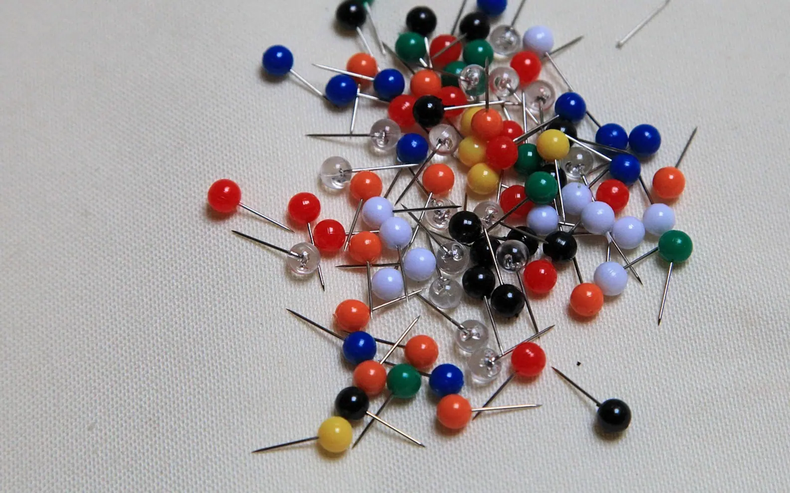 Pins, needles and pin board